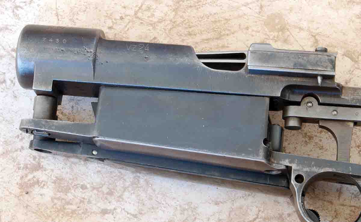 A Mauser M98 action lying on top of new bottom metal that adds about .25 inch to the magazine depth.